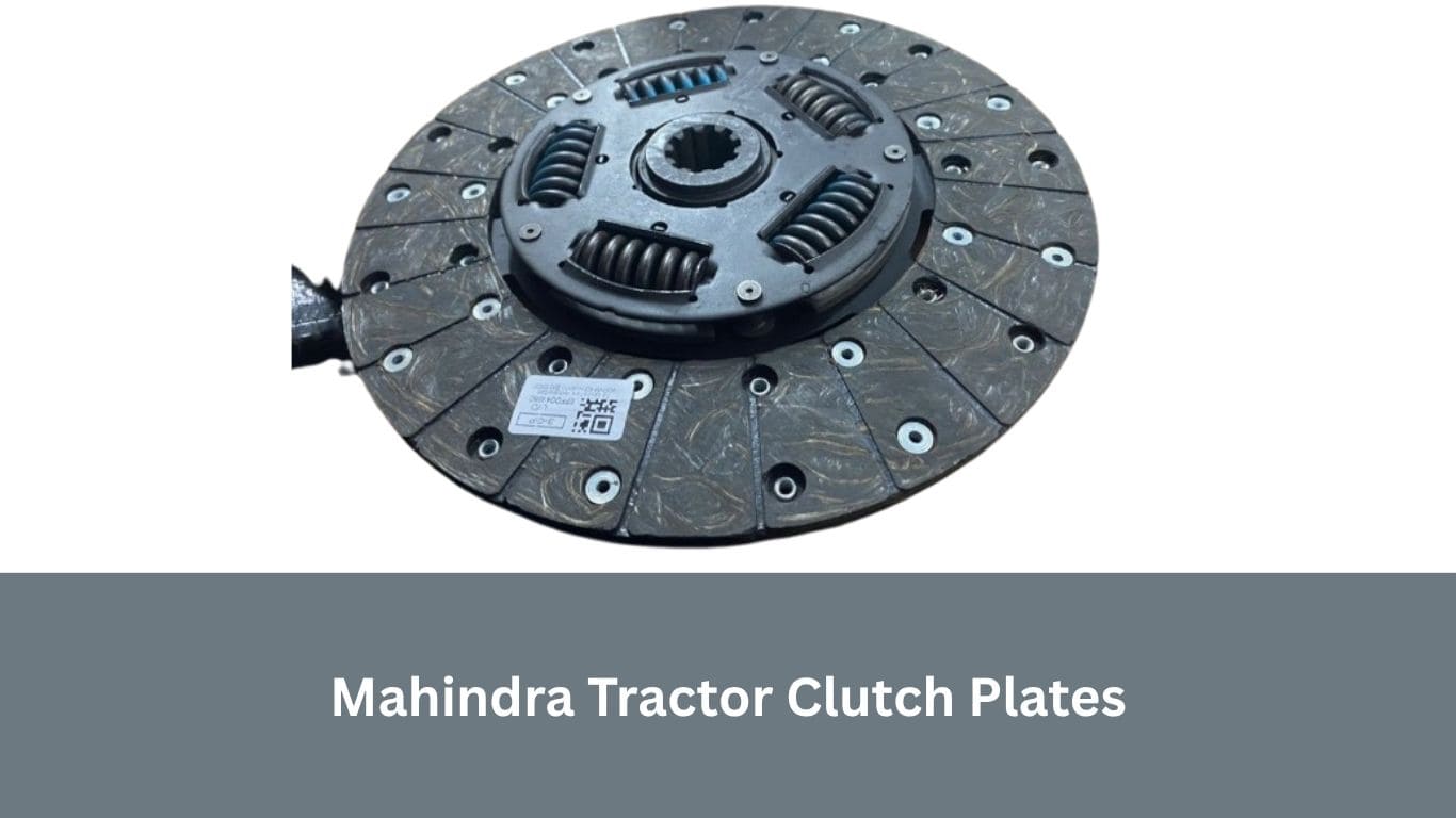 Mahindra tractor clutch plates placed on a mechanic's table, highlighting precision finish and authentic branding.