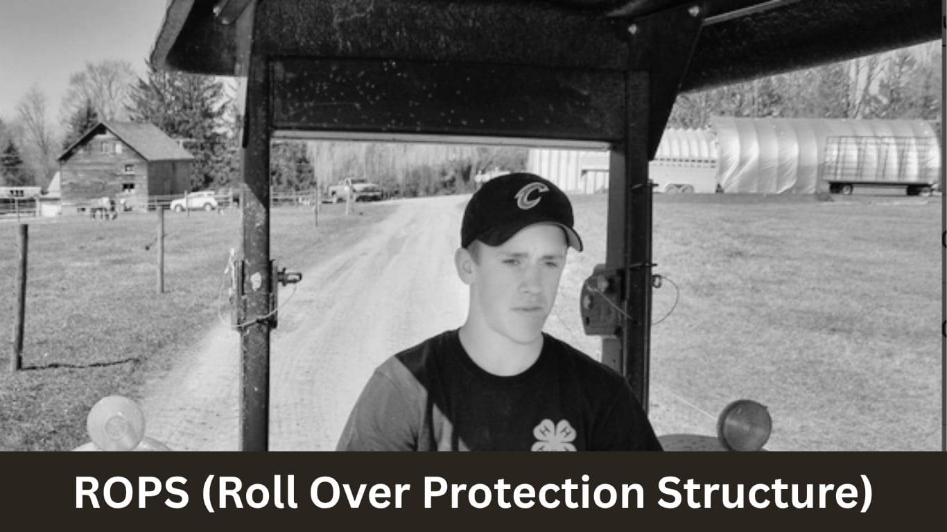 A modern tractor with a reinforced Roll-Over Protective Structure (ROPS) cab